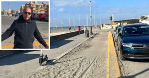 Giuseppe Conforzi sulla pista ciclabile di Ostia piena di sabbia